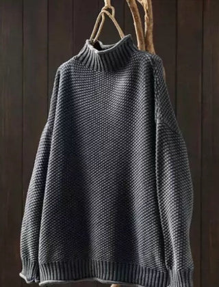 Jade green knit sweater for women by Christine Brewer, featuring a cozy, textured design and long sleeves on a model.