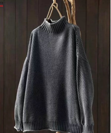 Jade green knit sweater for women by Christine Brewer, featuring a cozy, textured design and long sleeves on a model.