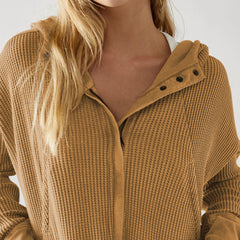 Mia cropped hooded hoodie for women by Christine Brewer, featuring a relaxed fit and adjustable drawstrings, shown in a neutral color.