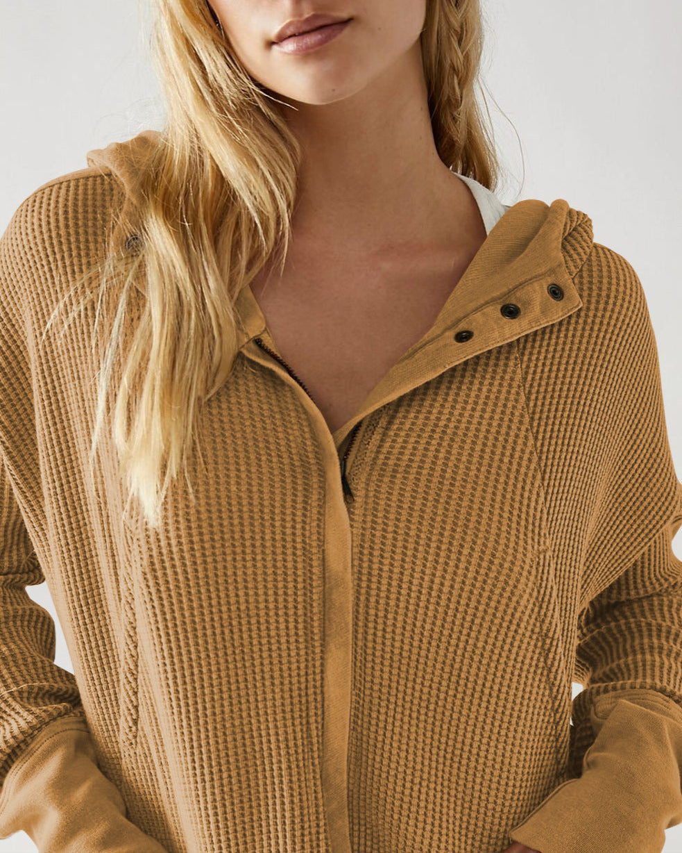 Mia cropped hooded hoodie for women by Christine Brewer, featuring a relaxed fit and adjustable drawstrings, shown in a neutral color.