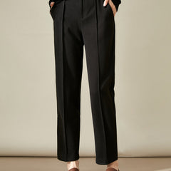 Women’s wool tapered trousers by Christine Brewer, stylish merino wool pants with a tailored fit and classic design.