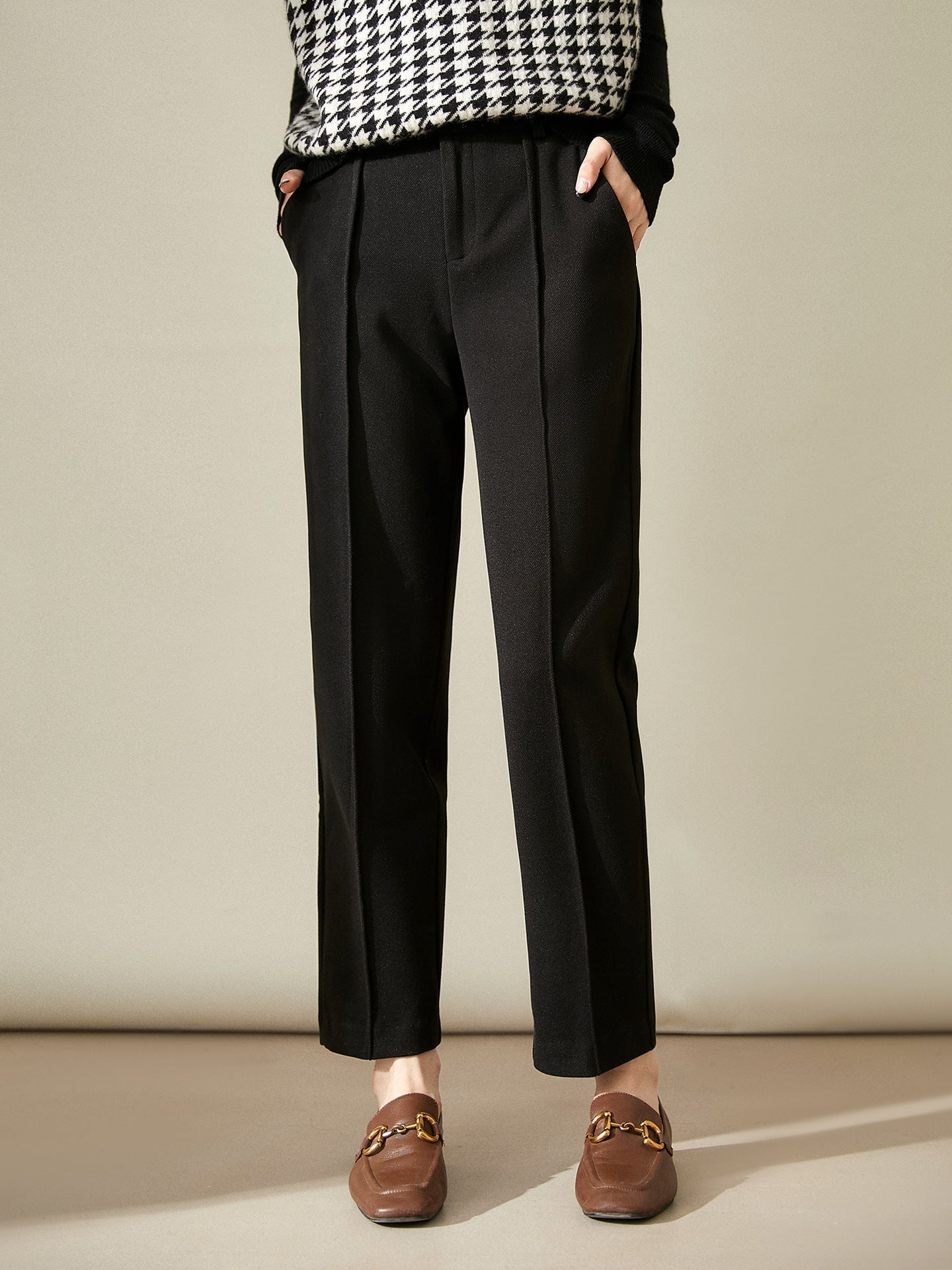 Women’s wool tapered trousers by Christine Brewer, stylish merino wool pants with a tailored fit and classic design.