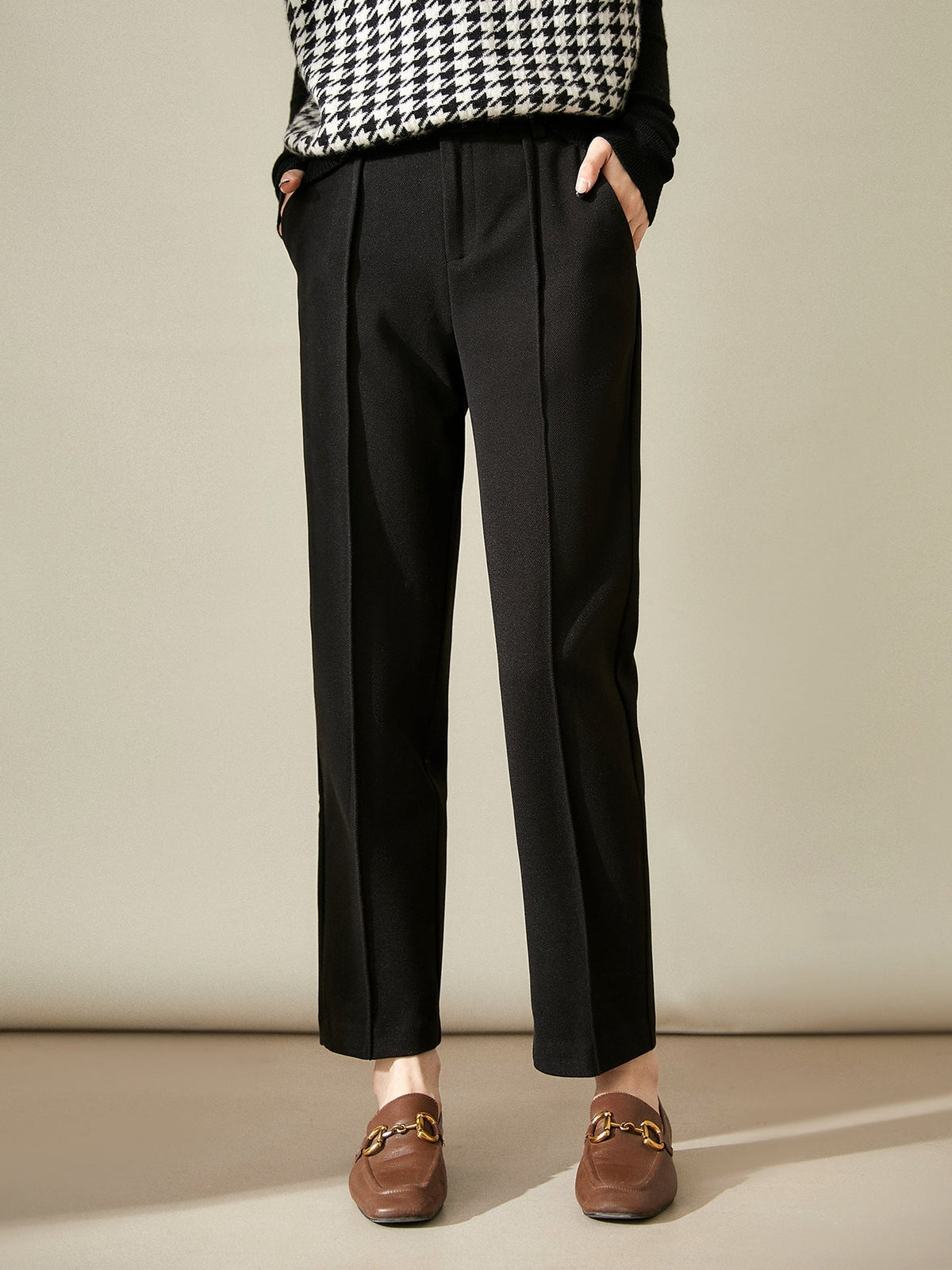 Women’s wool tapered trousers by Christine Brewer, stylish merino wool pants with a tailored fit and classic design.