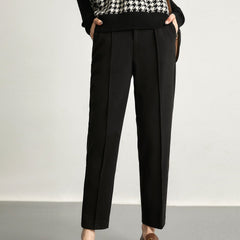 Women's wool tapered trousers by Christine Brewer, stylish merino pants with a tailored fit and classic design, shown in the image.