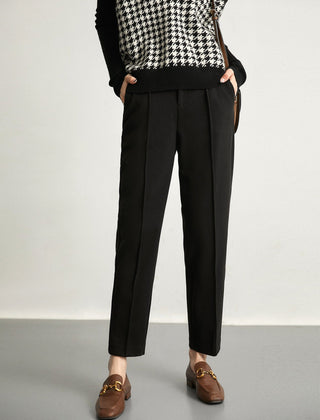 Women's wool tapered trousers by Christine Brewer, stylish merino pants with a tailored fit and classic design, shown in the image.