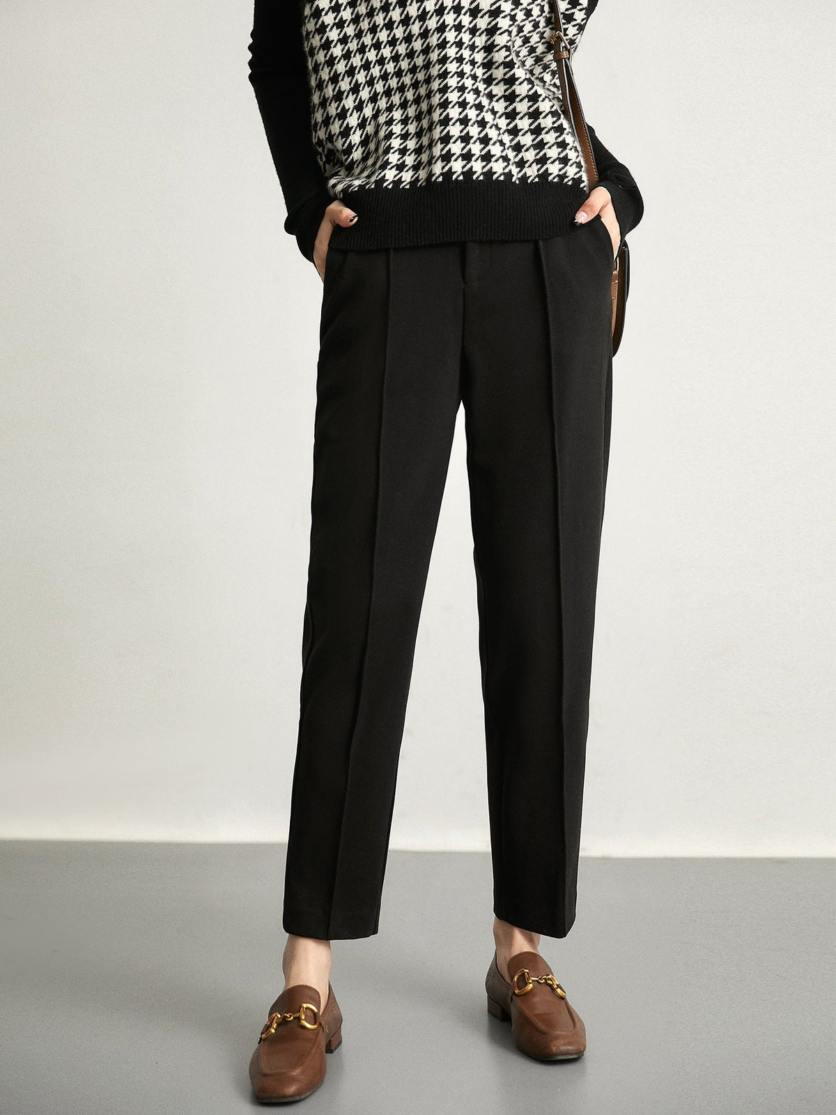 Women's wool tapered trousers by Christine Brewer, stylish merino pants with a tailored fit and classic design, shown in the image.