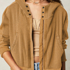 Mia cropped hooded hoodie for women by Christine Brewer, featuring a relaxed fit and soft fabric, shown in a casual outdoor setting.