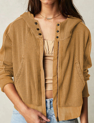 Mia cropped hooded hoodie for women by Christine Brewer, featuring a relaxed fit and soft fabric, shown in a casual outdoor setting.