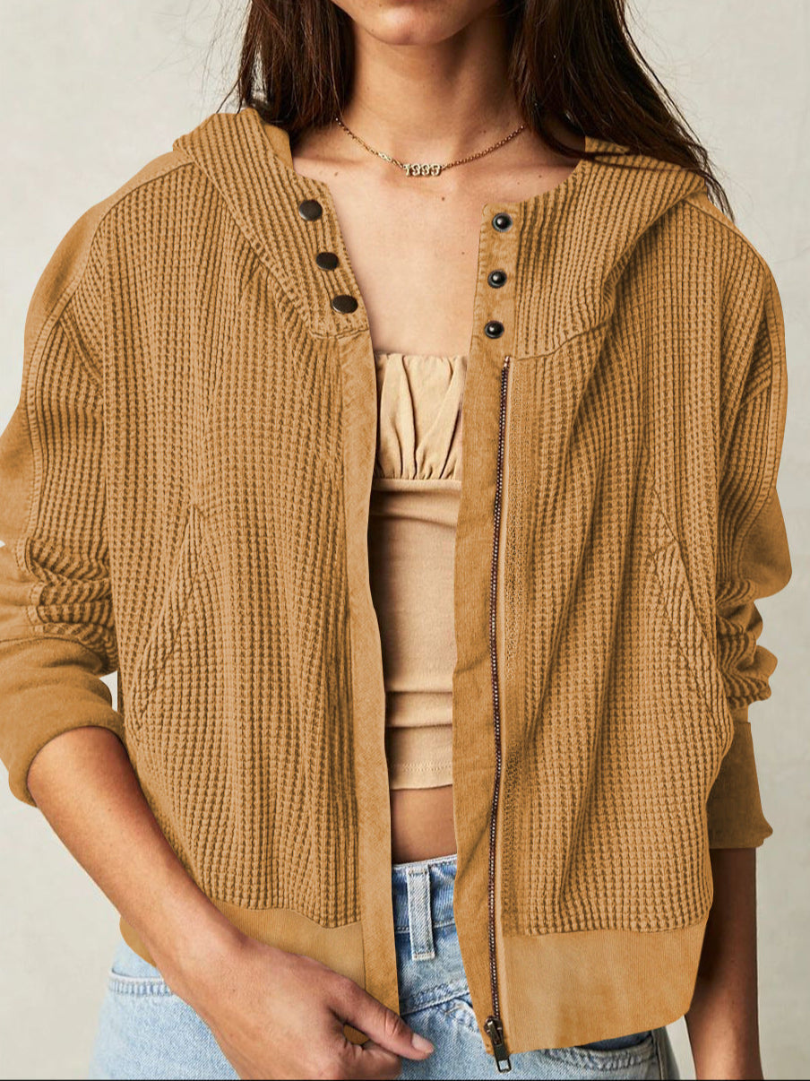 Mia cropped hooded hoodie for women by Christine Brewer, featuring a relaxed fit and soft fabric, shown in a casual outdoor setting.