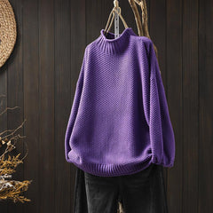 Jade green knit sweater for women by Christine Brewer, featuring a cozy, textured design and long sleeves.