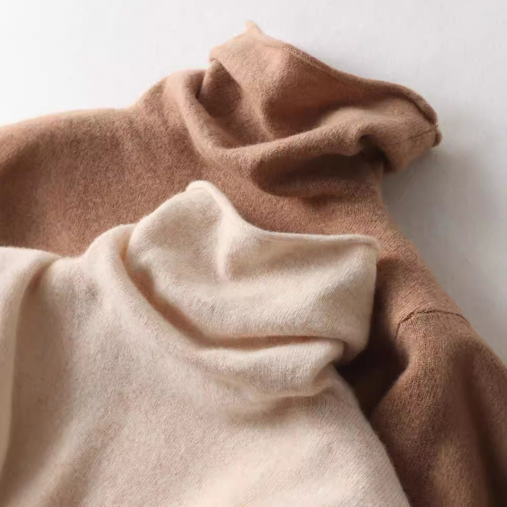 Cream-colored Gabrielle cashmere turtleneck sweater for women, soft and cozy, worn by a woman in a stylish indoor setting.