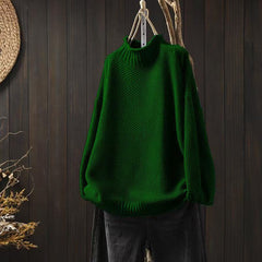 Women’s jade green knit sweater by Christine Brewer, featuring a cozy, textured fabric and a classic fit.