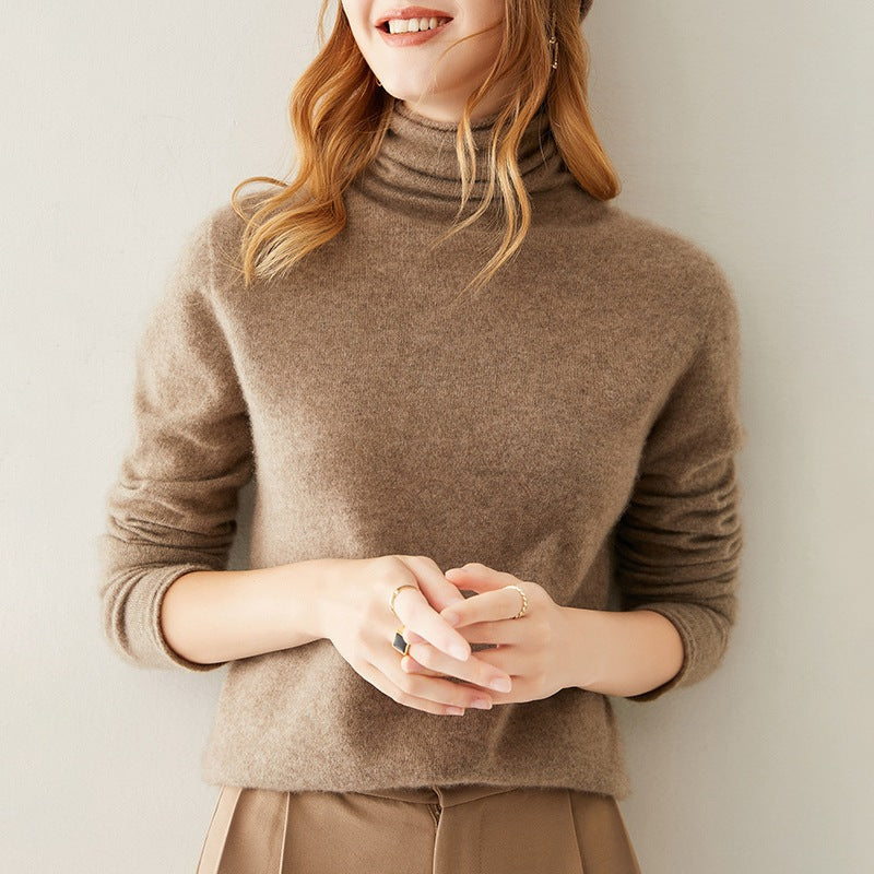Cream-colored Gabrielle cashmere turtleneck sweater for women by Christine Brewer, soft knit fabric with a cozy fit.