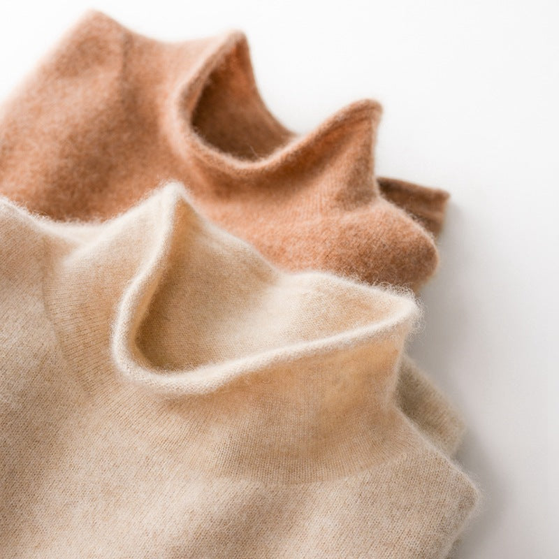 Cream-colored Gabrielle cashmere turtleneck sweater for women by Christine Brewer, displayed on a neutral background.
