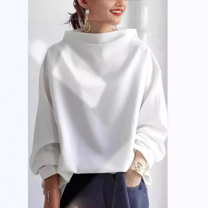 Christine Brewer Isabella soft knit high neck top in versatile, sophisticated design, shown in a close-up view highlighting the fabric.