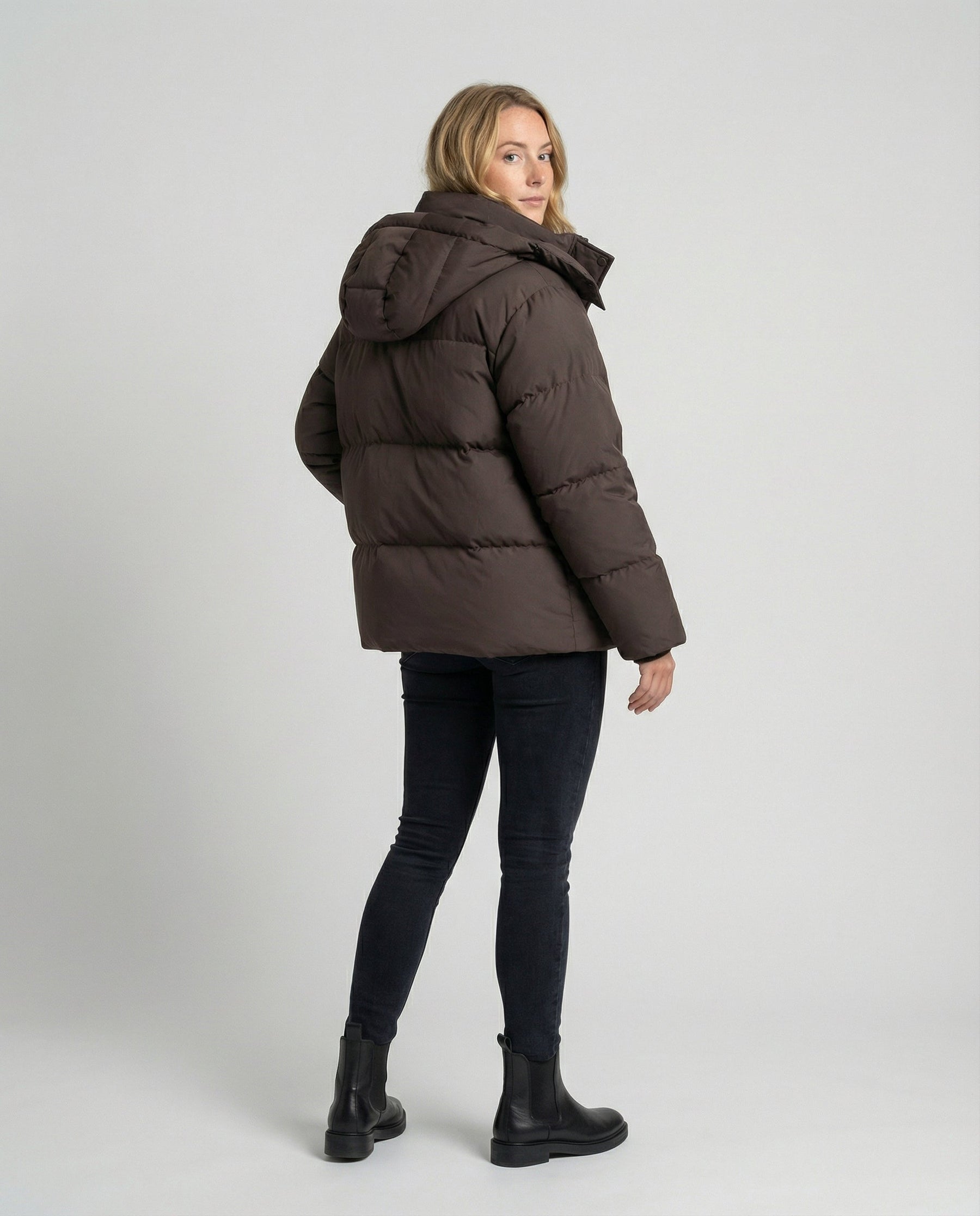 Back view of Christine Brewer Penelope oversized puffer jacket for women, stylishly designed with a quilted, warm, and padded silhouette.