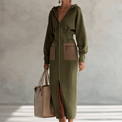 Green long sleeve maxi dress by Christine Brewer, elegant evening dress with flowing fabric and fitted bodice.
