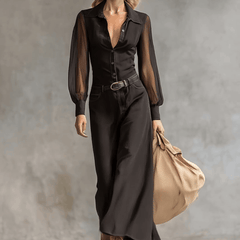 Black denim V-neck maxi dress by Christine Brewer, casual style with flowing silhouette, displayed on a hanger.