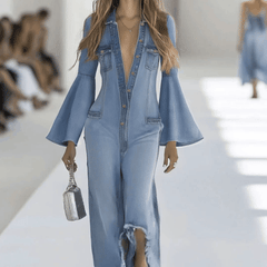 Light blue denim flared long sleeve wide-leg jumpsuit for women by Christine Brewer, shown with full-length view.