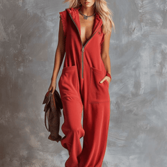 Raspberry red cotton hoodie jumpsuit for women with zip-front design, by Christine Brewer, featuring a relaxed fit and hood.