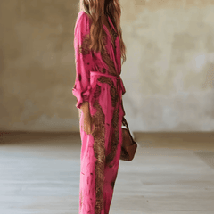 Rose red leopard print chiffon long sleeve women's jumpsuit with wide-leg pants by Christine Brewer, featuring a stylish, flowy silhouette.