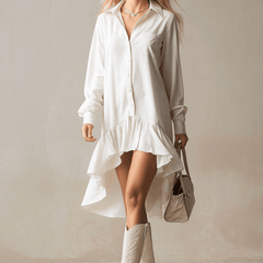 White denim ruffle midi dress by Christine Brewer, featuring a flowing silhouette with ruffled details, perfect for elegant evening wear.