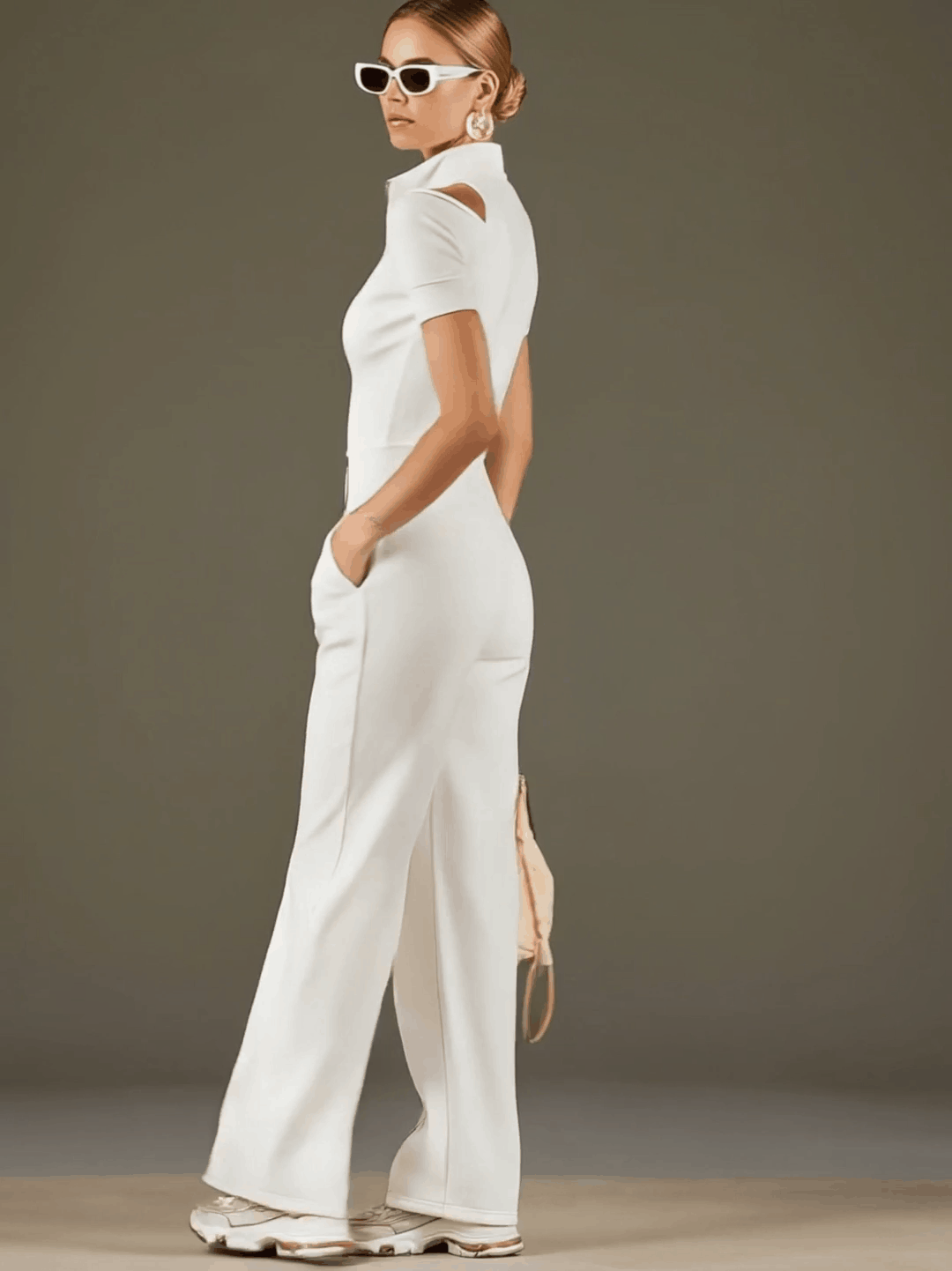 White cotton blend wide-leg jumpsuit for women with short sleeves, styled as pants, by Christine Brewer.