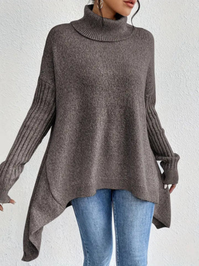 Cream-colored high neck sweater for women by Christine Brewer, featuring a cozy, stylish design with a high neckline and soft fabric.