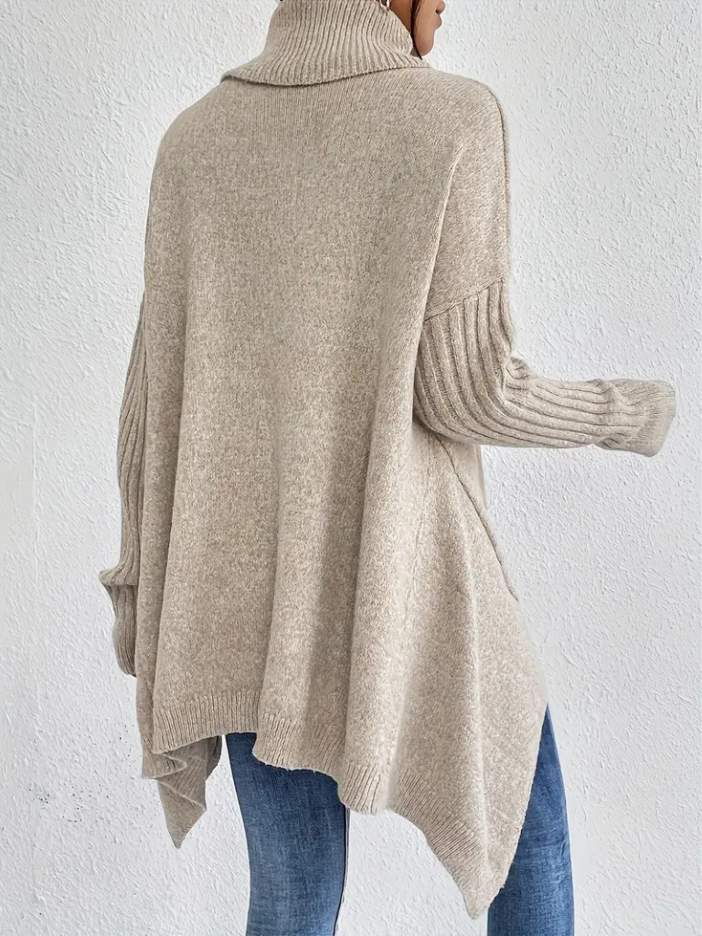 Women’s high neck sweater by Christine Brewer featuring a cozy, stylish design in a neutral color.