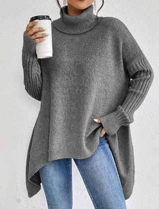 Women’s high neck sweater by Christine Brewer featuring a cozy design and soft fabric, shown in a neutral color.