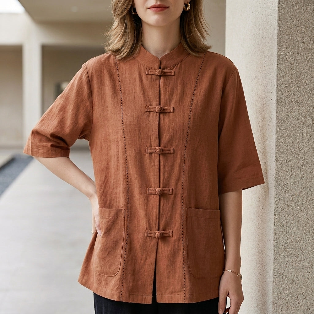 Orange women's summer blouse by Christine Brewer featuring denim pockets and a lightweight, casual top for warm weather.