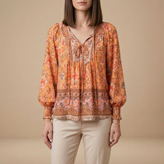 Orange floral long sleeve linen summer blouse for women by Christine Brewer, featuring a lightweight and stylish top.