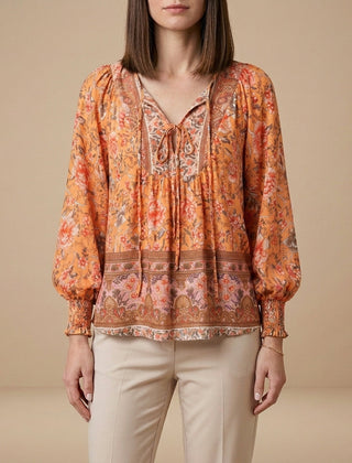 Orange floral long sleeve linen summer blouse for women by Christine Brewer, featuring a lightweight and stylish top.