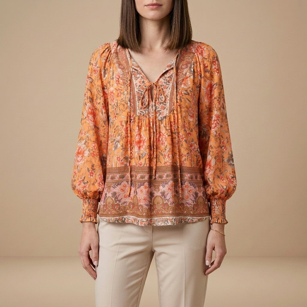Orange floral long sleeve linen summer blouse for women by Christine Brewer, featuring a lightweight and stylish top.
