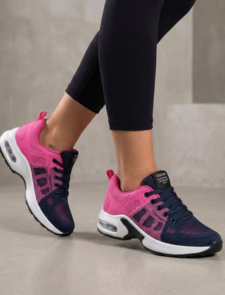 Pink and blue knit sneakers for women by Christine Brewer, showcasing comfortable, stylish women's shoes with a colorful design.