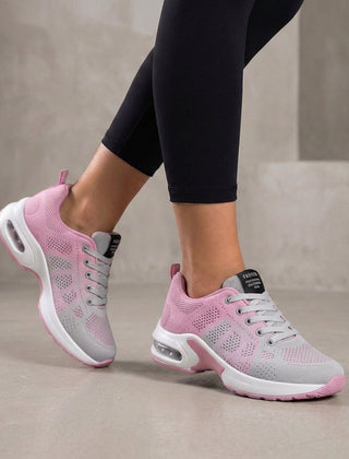 Pink knit sneakers for women by Christine Brewer, featuring a comfortable woven design and casual athletic style.