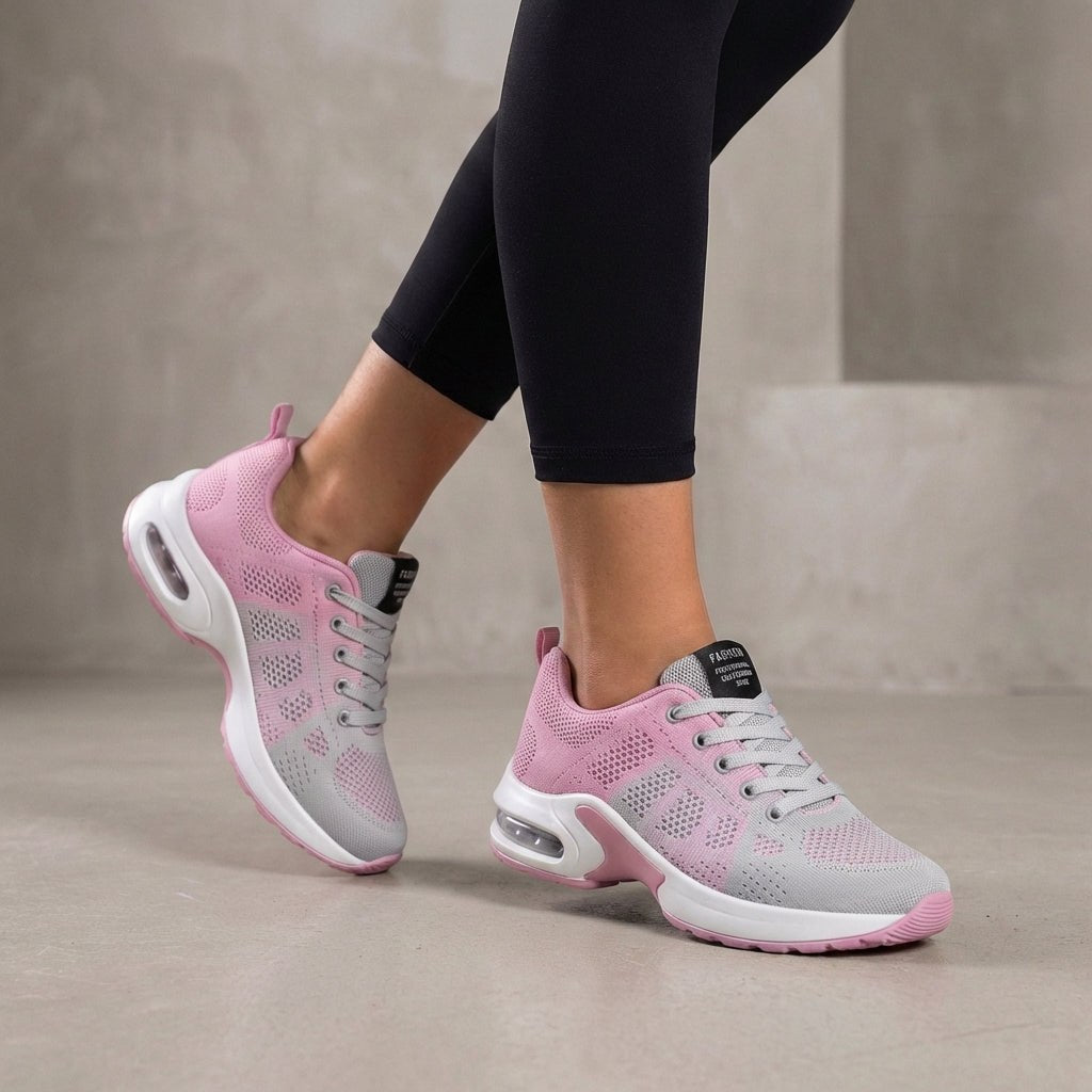 Pink knit sneakers for women by Christine Brewer, featuring a comfortable woven design and casual athletic style.