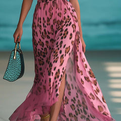 Pink chiffon V-neck maxi dress for women by Christine Brewer, flowing fabric with elegant drape and sleeveless design.