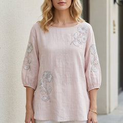 Pink floral summer blouse for women with puff sleeves, stylish top by Christine Brewer, perfect for warm-weather fashion.