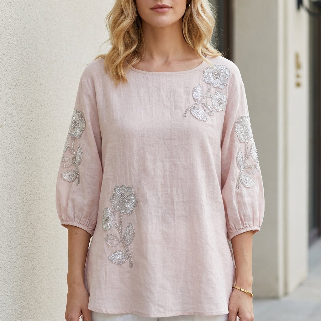 Pink floral summer blouse for women with puff sleeves, stylish top by Christine Brewer, perfect for warm-weather fashion.