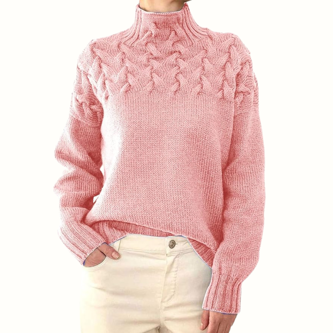 Pink women's turtleneck sweater from Christine Brewer's Tessa knitwear collection, showcasing a cozy and stylish design.