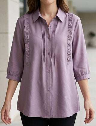 Purple denim ruffle summer blouse for women by Christine Brewer, featuring a stylish and flowy design, perfect for warm weather.
