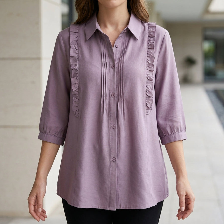 Purple denim ruffle summer blouse for women by Christine Brewer, featuring a stylish and flowy design, perfect for warm weather.
