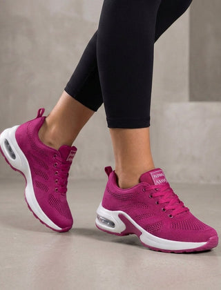 Purple knit sneakers for women by Christine Brewer, showcasing a comfortable and stylish women's shoe design.