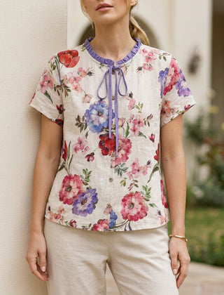 Purple floral summer blouse for women by Christine Brewer, short sleeve top with a relaxed fit and feminine design.