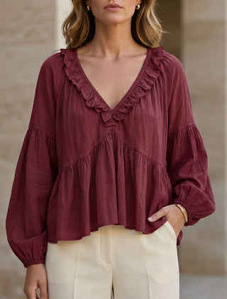 Red Christine Brewer women's summer blouse with v-neck, long sleeves, and ruffle denim design, perfect for casual style.