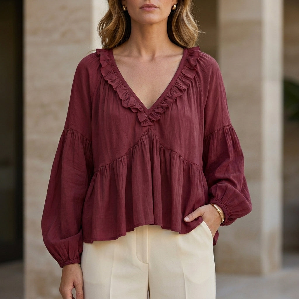 Red Christine Brewer women's summer blouse with v-neck, long sleeves, and ruffle denim design, perfect for casual style.