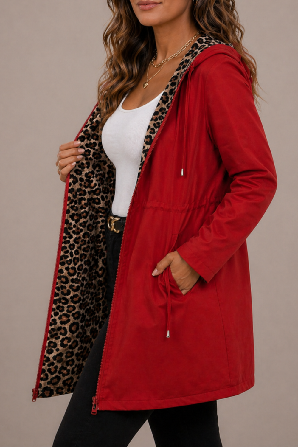 Reversible women's long hooded coat by Christine Brewer, showcasing both stylish exterior and cozy inner lining.