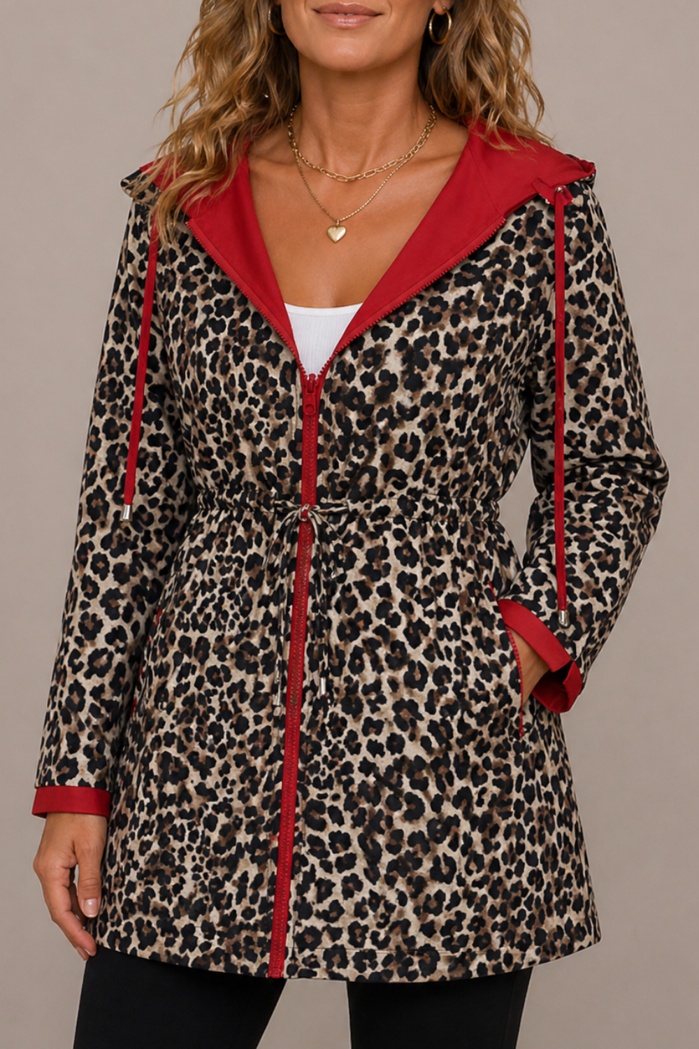Reversible women's long hooded coat by Christine Brewer, stylish double-sided design with a cozy fit and versatile appearance.