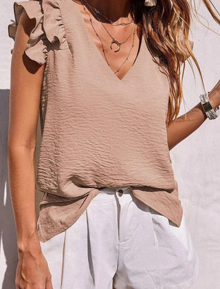 Women's v-neck top with ruffle sleeves by Christine Brewer, shown in a stylish, casual design suitable for everyday wear.